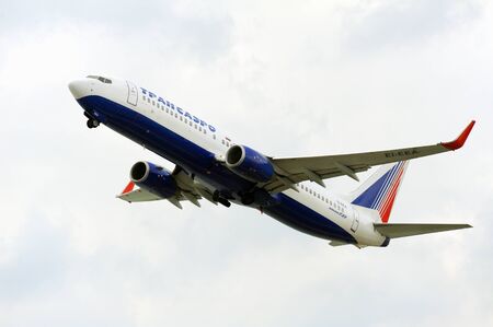 KERKIRA, GREECE- SEPTEMBER 13:Transaero passenger airplane takeoff from active runway at  Kerkira international airport on September 13, 2012 in Kerkira, Greeceのeditorial素材