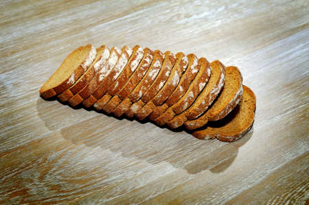 Sliced rye bread served on vintage tableの写真素材