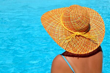 Real female beauty enjoying her summer vacation at swimming poolの写真素材