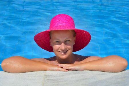 Real female beauty relaxing in swimming pool, summer vacation concept