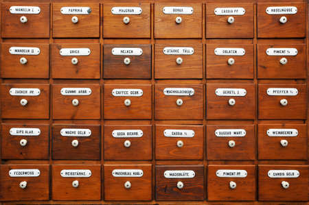 Vintage shelf with different organic vegetable spicesの写真素材