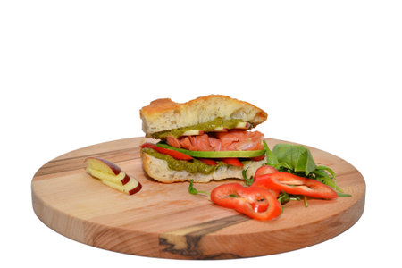 Pizza sandwich served on wooden plate, isolated on whiteの写真素材