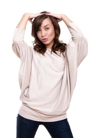 Beautiful young adult girl posing in studio on white backroundの写真素材