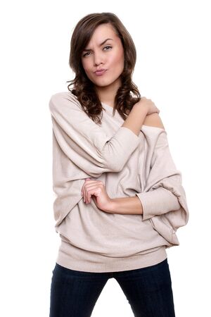 Beautiful young adult girl posing in studio on white backroundの写真素材