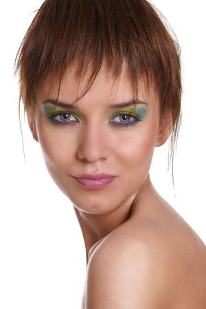 Beautiful portrait of pretty young woman with fashion eye make-up on white backgroundの写真素材