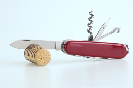 A swiss army knife cutting a corkの写真素材