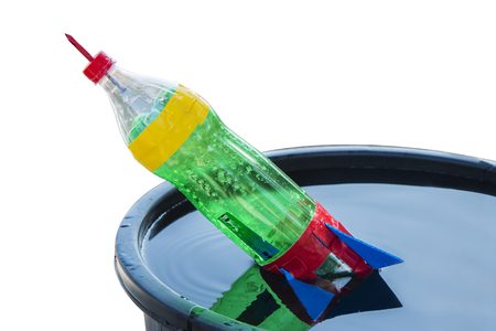 close-up of colorful water bottle rocket on white backgroundの写真素材
