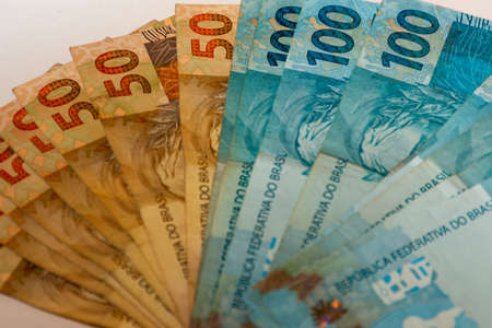 Money bills spread across the tableの写真素材