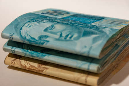 Money bills spread across the tableの写真素材