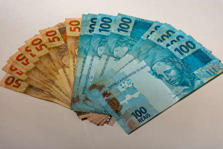 Money bills spread across the tableの写真素材