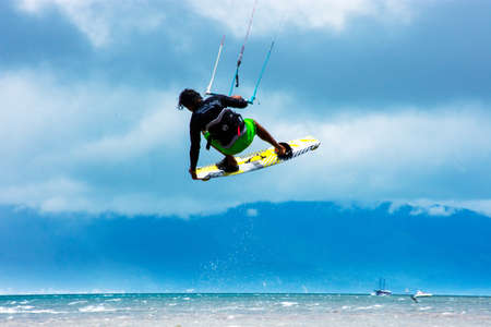Boy practicing kitesurfing in Ilhabela