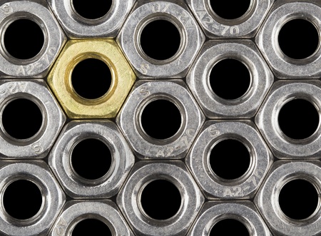 Golden Screw Nut In Steel Nuts Pattern isolated on black