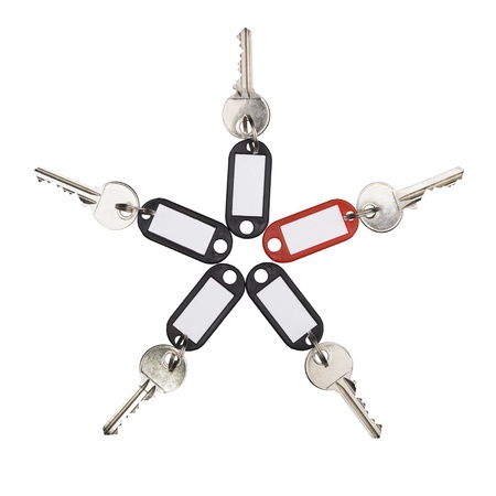 Key With Red Tag and four keys with black tags isolated on white  Concept of extraordinary solution の写真素材