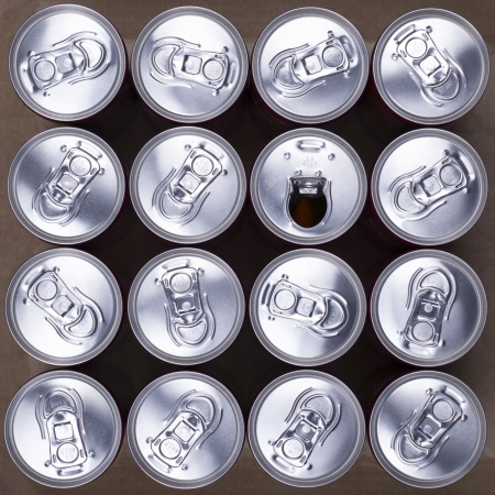 16 Drink Cans With One Opened  Top view の写真素材
