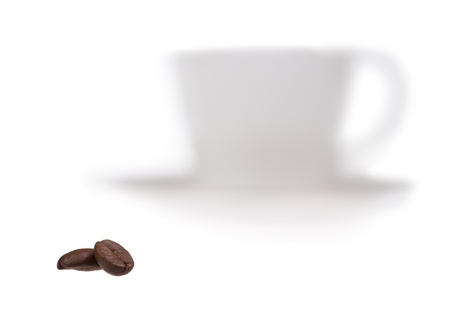 Closeup of two coffee beans with out of focus cup of coffee on background isolated on whiteの写真素材