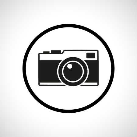 Vintage photo camera in a circle. Black flat icon with shadow.のイラスト素材