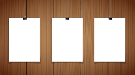 Set of 2 blank posters hanging on a thread with black clipsagainst a wooden wall as a minimalistic style portfolio, gallery presentation concept. 3d illustrationのイラスト素材