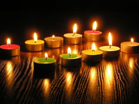 On a photo of a candle as different figures. A photo on a dark background. The photo is made in Ukraine.の写真素材