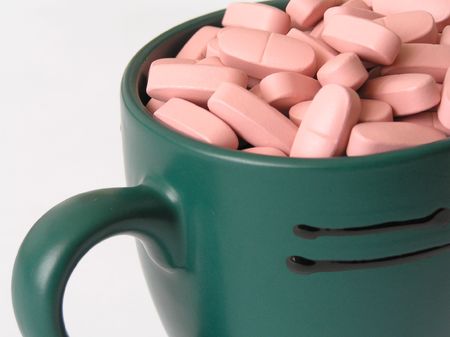 On a photo of a tablet in a mug.The photo is made in Ukraine.の写真素材