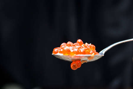 Red caviar in the spoonの写真素材