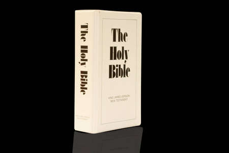 on photo Bible on black background