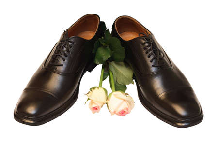 man shoes and roses on white backgroundの写真素材