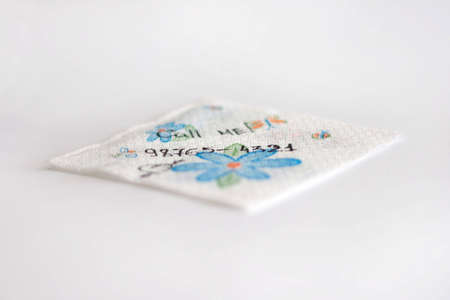 napkin on grei background. The inscription on a napkin-Call meの写真素材