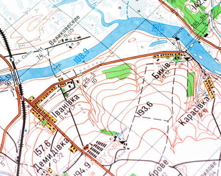 topographic map and hand with pen
