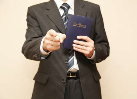 Man in suit with Holy Bibleの写真素材