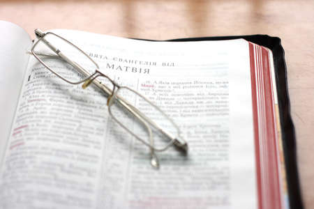In the photo Open Bible with glassesの写真素材