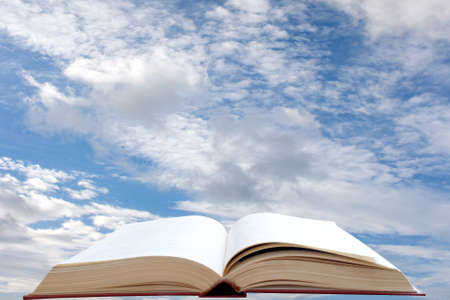 Open book and sky backgroundの写真素材