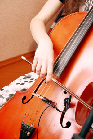A young girl playing the celloの写真素材