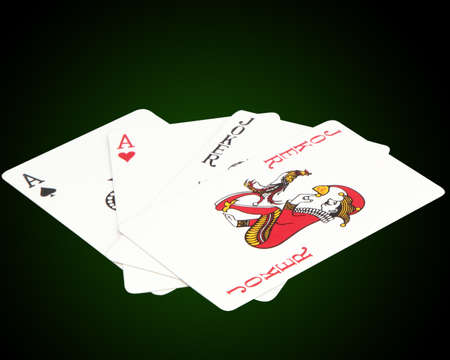 Playing cards. ace and a joker on a green backgroundのeditorial素材