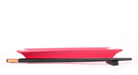 Oriental plates and chopsticks set isolated on white with shadow.の写真素材