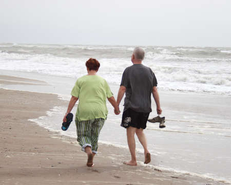 couple walking on the beachの写真素材