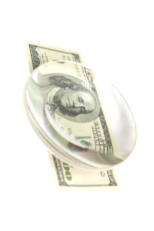 $ 100 bill under the lens, isolated on white backgroundの写真素材