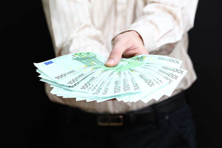 Man with euro money in hand