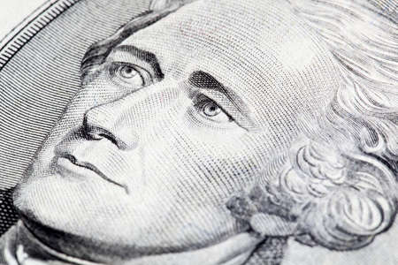 Portrait of Alexander Hamilton in front of the five dollar bill