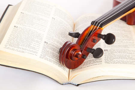 violin with open book isolated onwhite backgroundの写真素材