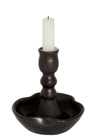 candle on a candlestick isolated on whiteの写真素材