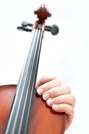 Woman hand with violin on white backgroundの写真素材