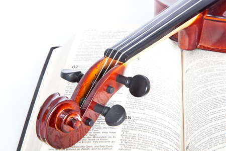 violin with open book isolated onwhite backgroundの写真素材