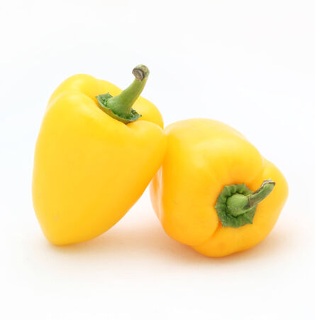 yellow peppers on a white backgroundの写真素材