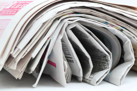 newspaper roll isolated on white backgroundの写真素材