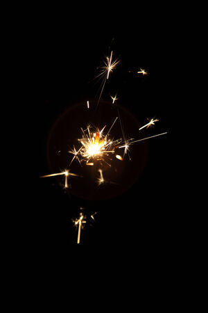 burning sparkler on a dark backgroundの写真素材
