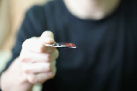 boys hand with a credit cardの写真素材