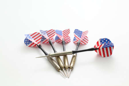 darts with the American flag on a white backgroundの写真素材