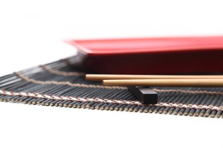 bamboo mat and red bowl for sushiの写真素材