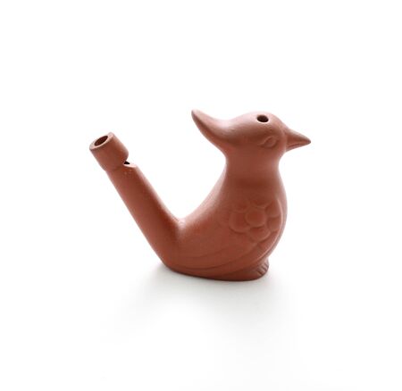 Clay bird whistle isolated on whiteの写真素材
