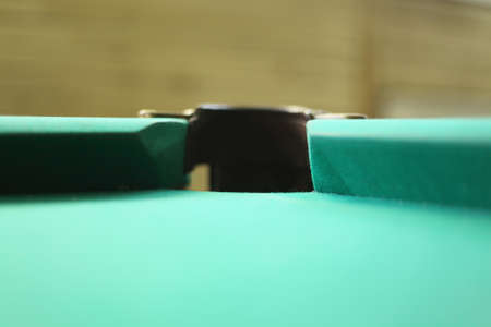 Green billiards table. hole
